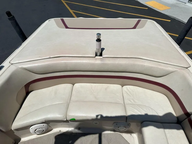 Slide: The Image of 1999 Centurion Elite-V C4 boat interior with beige seating and maroon accents. - 10