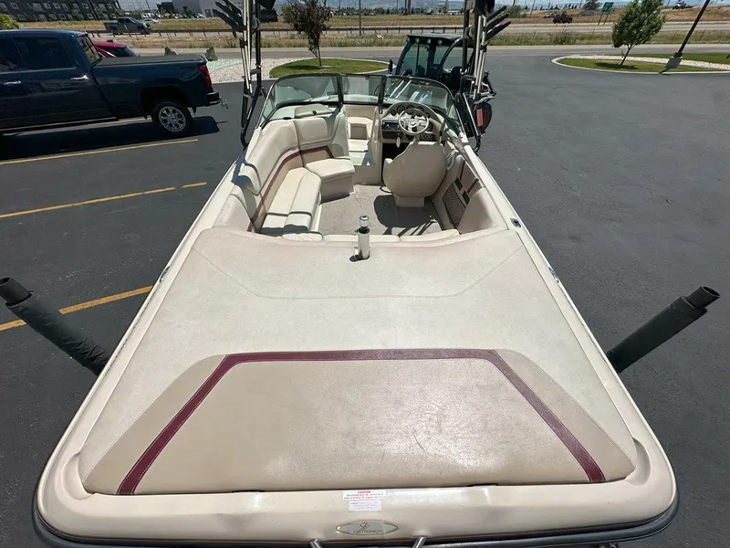 Slide: The Image of 1999 Centurion Elite-V C4 boat interior with beige seating and steering wheel. - 11
