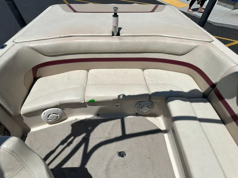 Slide: The Image of Interior seating of a 1999 Centurion Elite-V C4 boat with beige upholstery. - 17