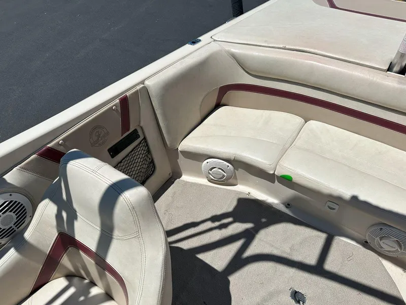 Slide: The Image of Interior of a 1999 Centurion Elite-V C4 boat with beige seating and speakers. - 18