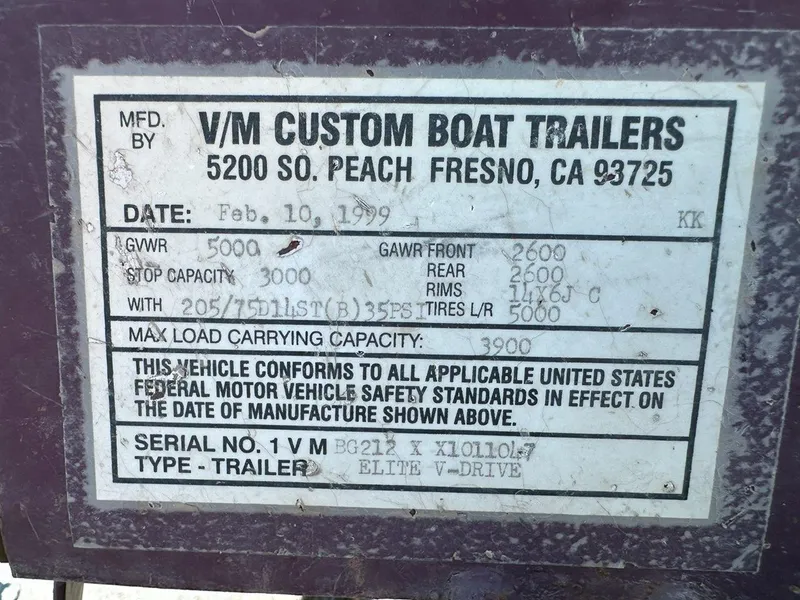Slide: The Image of Label on 1999 Centurion Elite-V C4 boat trailer detailing specifications and compliance information. - 24