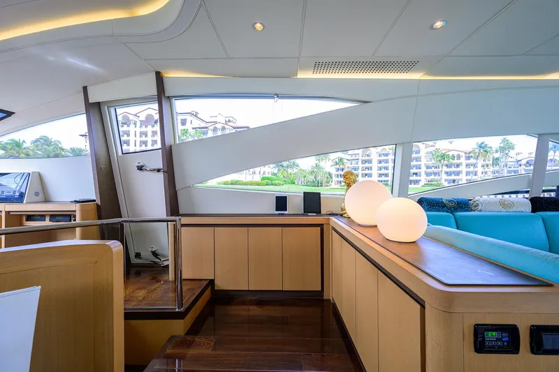 Slide: The Image of Interior of 2009 Pershing 90 Express yacht with modern design and large windows. - 11