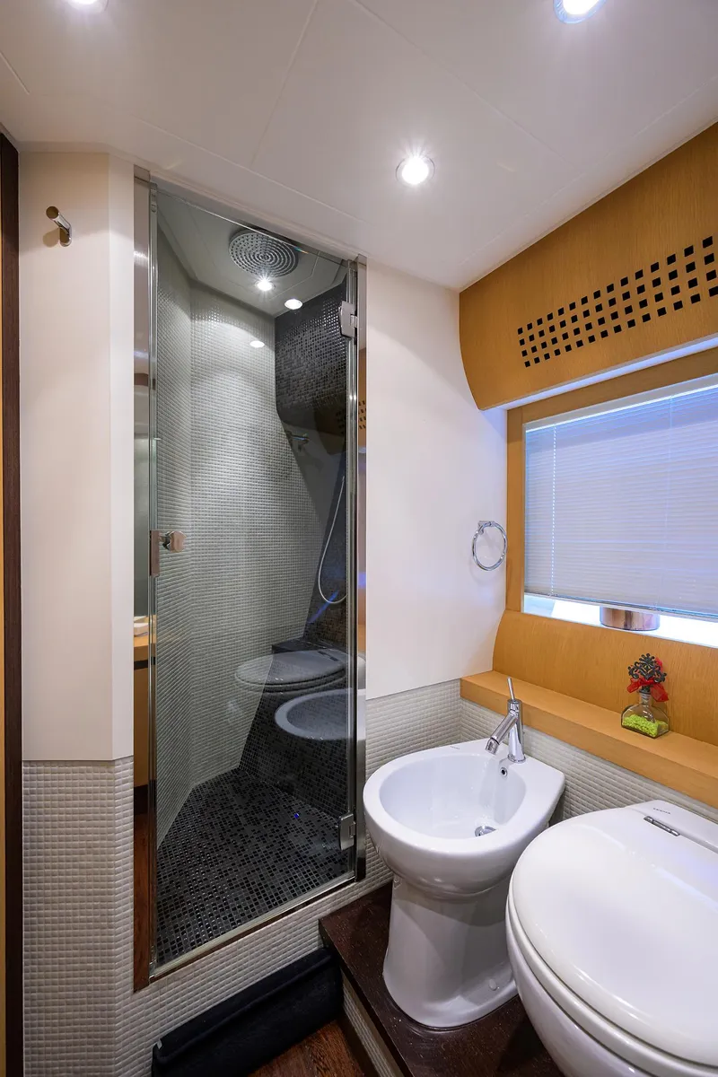 Slide: The Image of 2009 Pershing 90 Express yacht bathroom with modern shower and fixtures. - 28