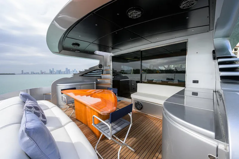 Slide: The Image of 2009 Pershing 90 Express yacht deck with modern seating and ocean view. - 39