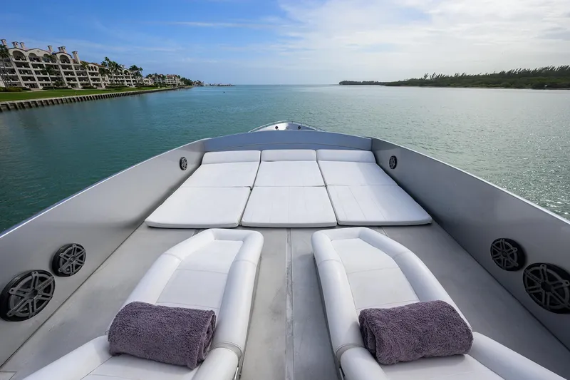 Slide: The Image of Luxurious 2009 Pershing 90 Express yacht with sun loungers and scenic water view. - 43