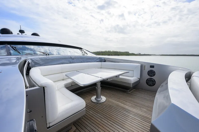 Slide: The Image of 2009 Pershing 90 Express yacht with outdoor seating area and table. - 46