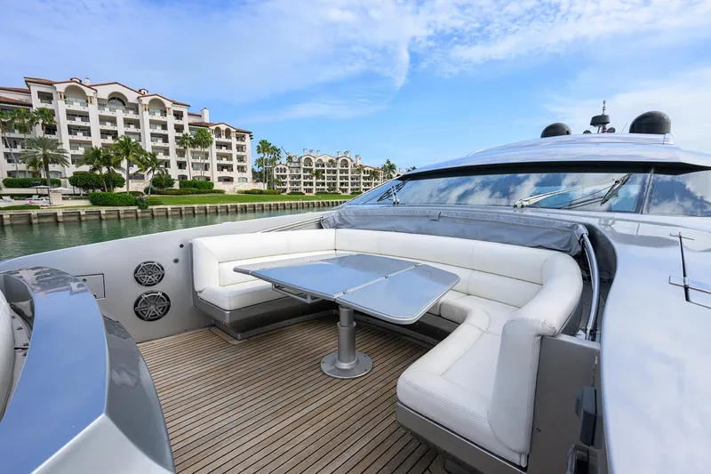Slide: The Image of 2009 Pershing 90 Express yacht with luxurious seating and waterfront view. - 48