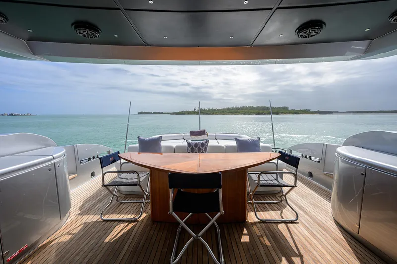Slide: The Image of 2009 Pershing 90 Express yacht deck with ocean view and seating area. - 6