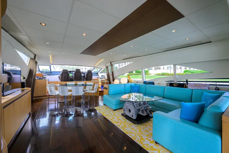 Slide: The Image of Luxurious interior of 2009 Pershing 90 Express yacht with modern seating and dining area. - 7