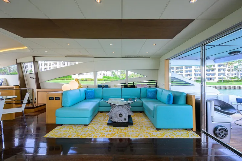 Slide: The Image of Luxurious interior of 2009 Pershing 90 Express yacht with turquoise seating and modern decor. - 8
