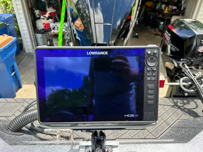 Slide: The Image of Lowrance HDS-12 fishfinder on a 2022 Vexus DVX20 boat, garage background. - 13