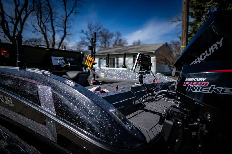 Slide: The Image of 2022 Vexus DVX20 boat with Mercury Pro Kicker engine in a residential area. - 3