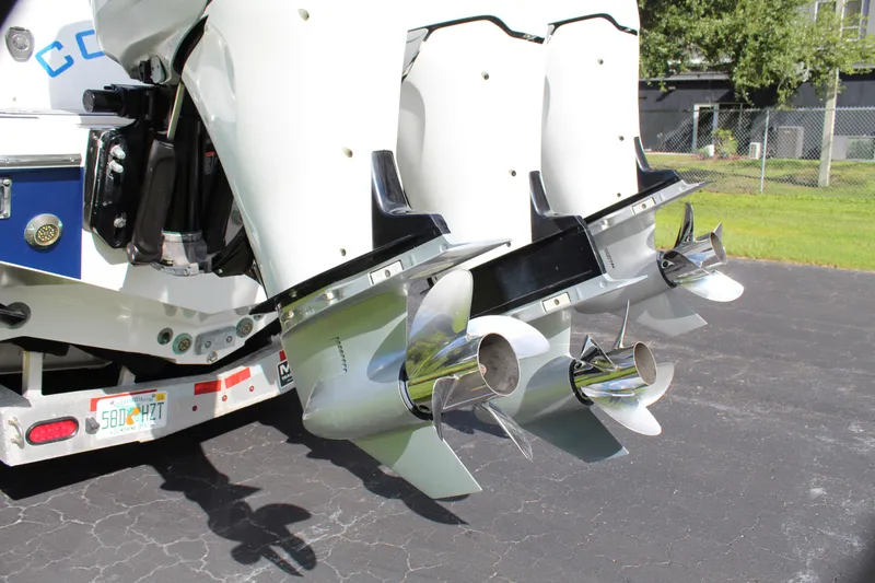 Slide: The Image of Triple outboard motors on a 2019 Nor-Tech 340 Sport Center Console boat. - 19