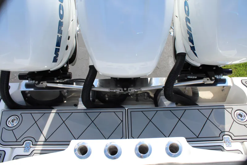 Slide: The Image of 2019 Nor-Tech 340 Sport Center Console with triple Mercury outboard engines. - 23