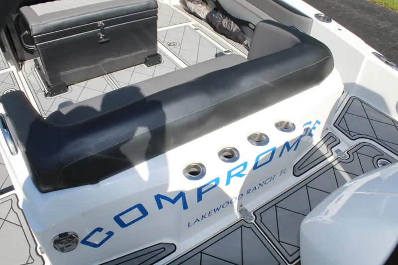 Slide: The Image of 2019 Nor-Tech 340 Sport Center Console interior with seating and custom flooring. - 26