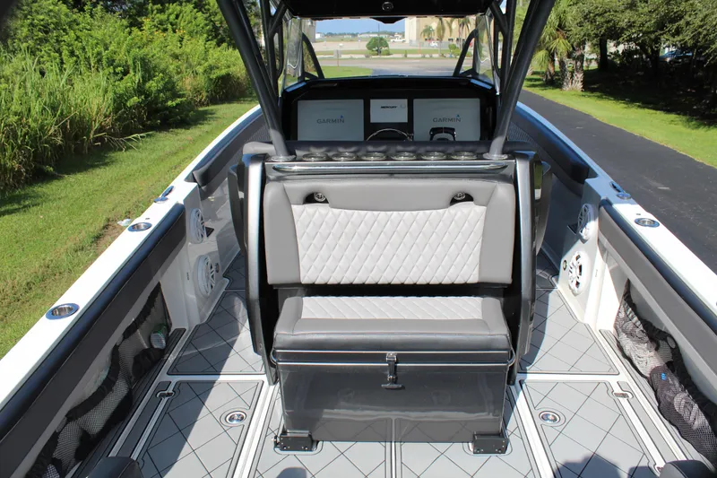 Slide: The Image of 2019 Nor-Tech 340 Sport Center Console interior with seating and console, featuring modern design. - 29