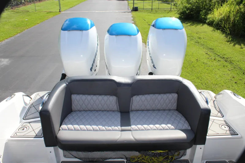 Slide: The Image of 2019 Nor-Tech 340 Sport Center Console with triple engines and cushioned seating. - 34
