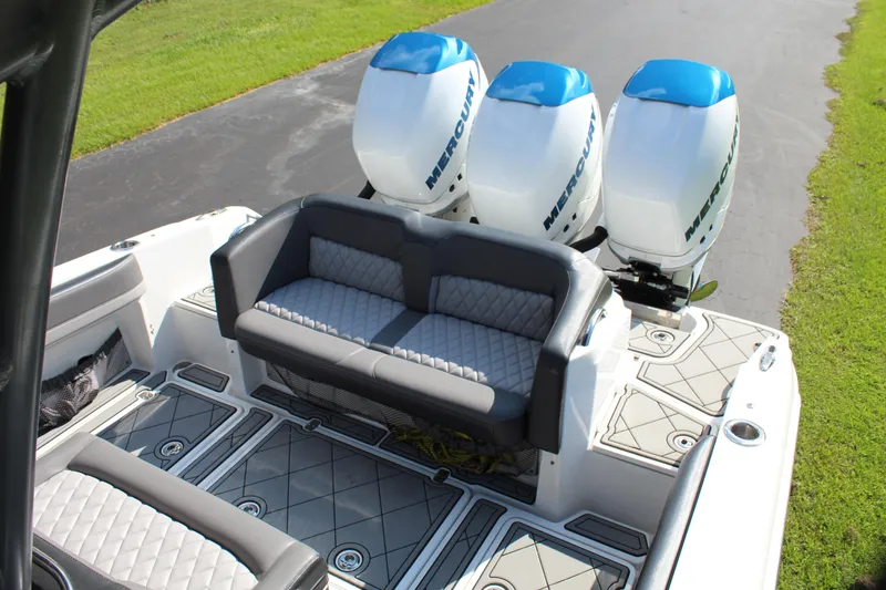 Slide: The Image of 2019 Nor-Tech 340 Sport Center Console with triple Mercury outboards and cushioned seating. - 35