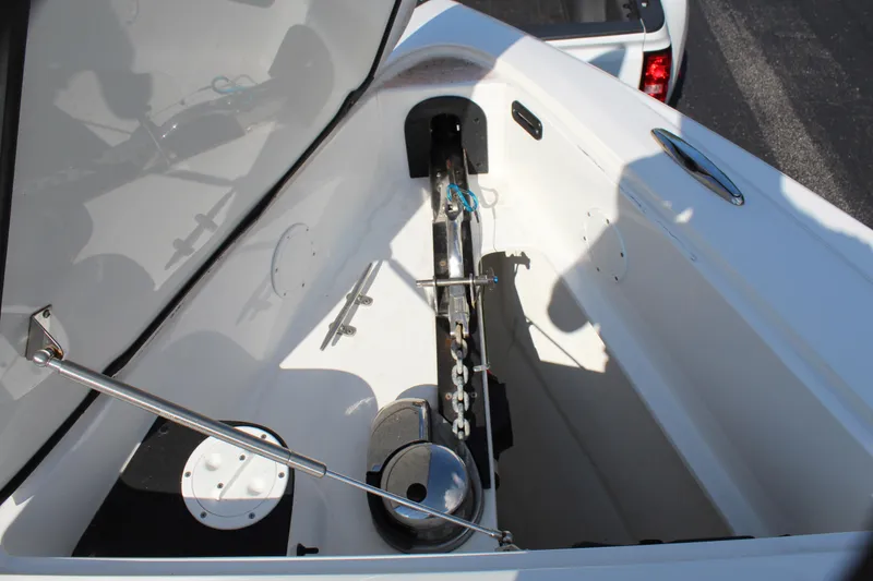 Slide: The Image of Open anchor compartment of 2019 Nor-Tech 340 Sport Center Console boat. - 48