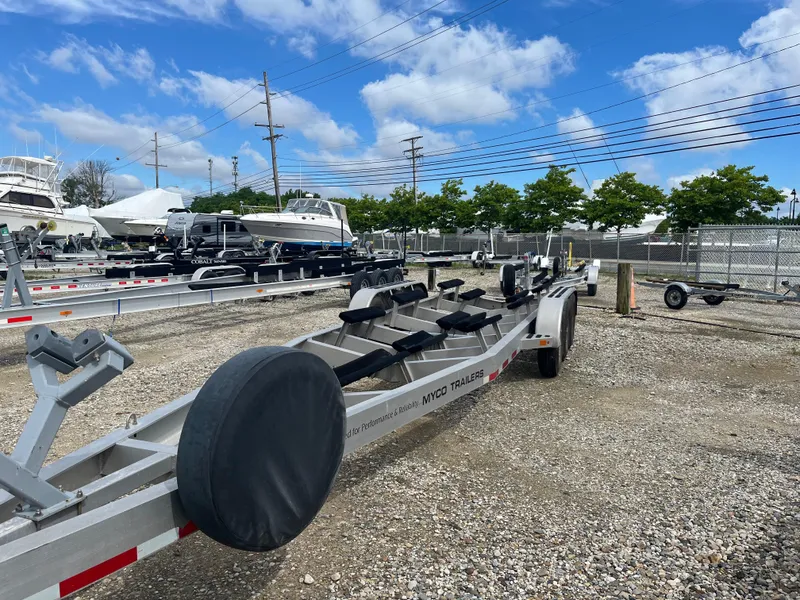 Slide: The Image of Boat trailer for 2019 Nor-Tech 340 Sport Center Console in a boatyard. - 63
