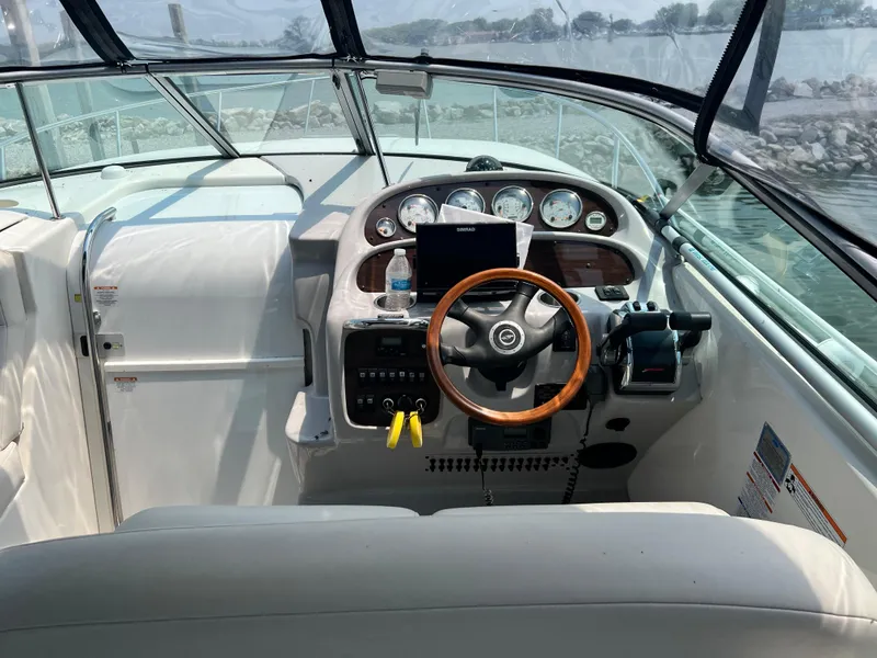 Slide: The Image of 2007 Chaparral Signature 280 boat helm with steering wheel and control panel. - 11