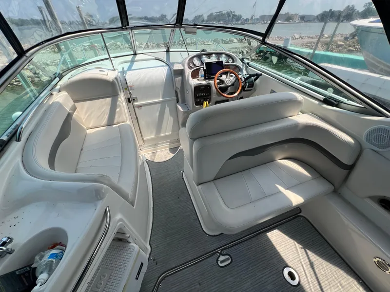 Slide: The Image of 2007 Chaparral Signature 280 boat interior with seating and steering console. - 15