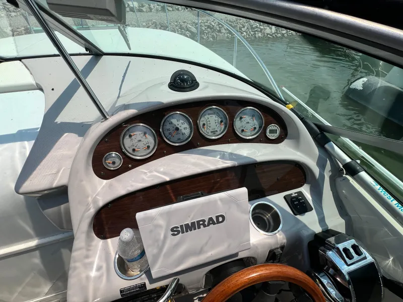 Slide: The Image of 2007 Chaparral Signature 280 boat dashboard with Simrad navigation system. - 19