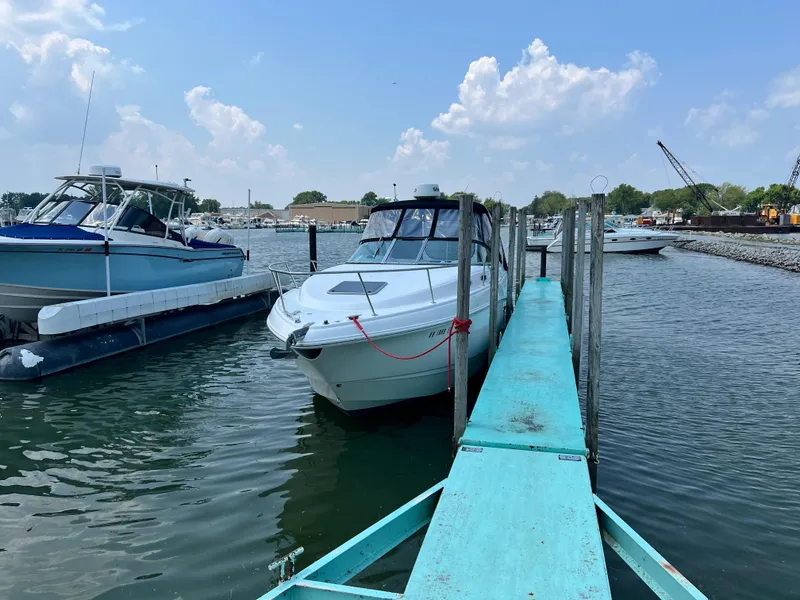 Slide: The Image of 2007 Chaparral Signature 280 docked at a marina on a sunny day. - 2