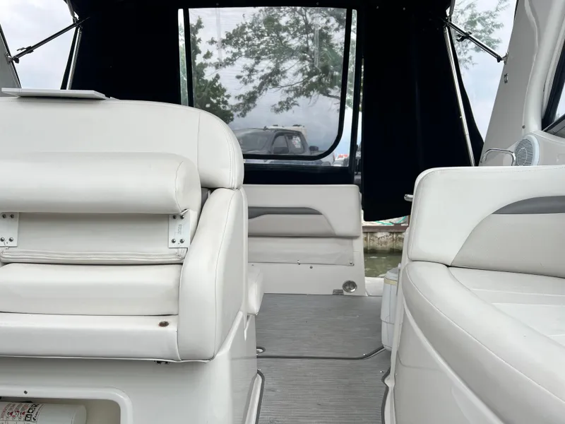 Slide: The Image of Interior of 2007 Chaparral Signature 280 boat with white leather seating. - 21