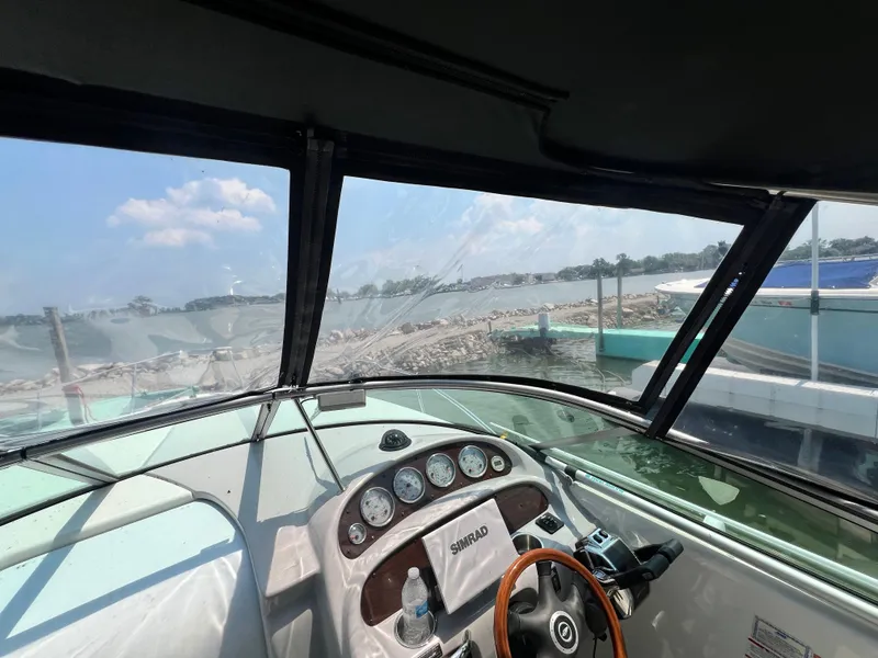 Slide: The Image of Interior view of 2007 Chaparral Signature 280 boat cockpit with lake in background. - 23