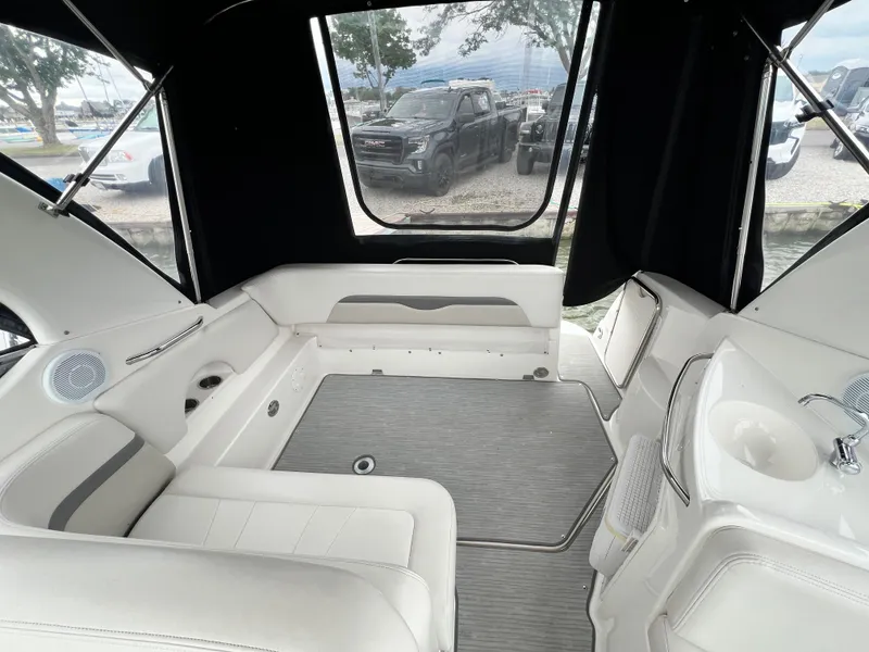 Slide: The Image of Interior of 2007 Chaparral Signature 280 boat with white seating and sink. - 28