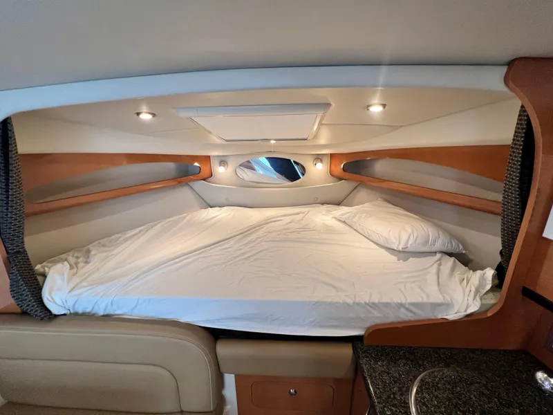 Slide: The Image of Interior cabin of 2007 Chaparral Signature 280 with bed and modern lighting. - 34