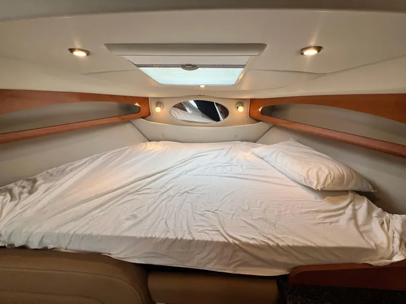 Slide: The Image of 2007 Chaparral Signature 280 cabin interior with bed, skylight, and ambient lighting. - 35