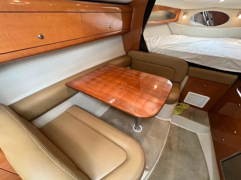 Slide: The Image of 2007 Chaparral Signature 280 cabin interior with dining area and bed. - 39