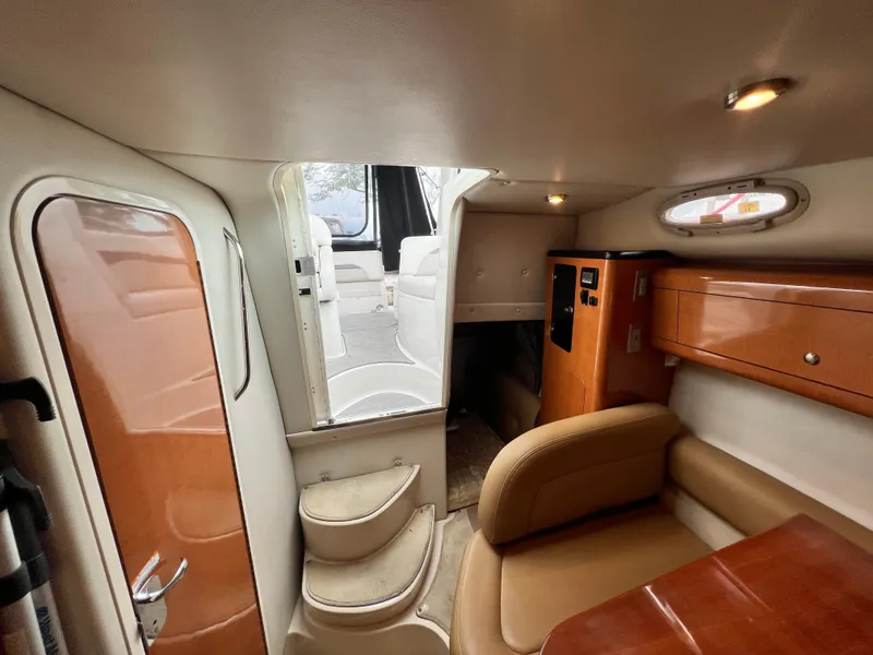 Slide: The Image of Interior of 2007 Chaparral Signature 280 boat with seating, stairs, and wooden cabinetry. - 41