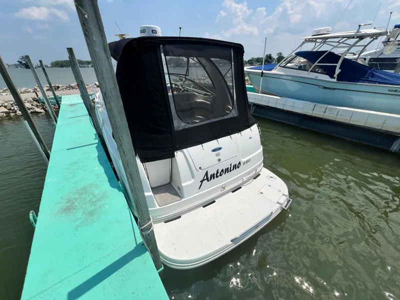 Slide: The Image of 2007 Chaparral Signature 280 boat docked at marina with black canopy. - 5