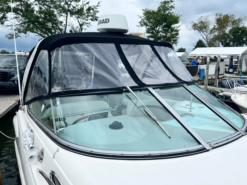 Slide: The Image of 2007 Chaparral Signature 280 boat docked, featuring a clear windshield and radar equipment. - 7