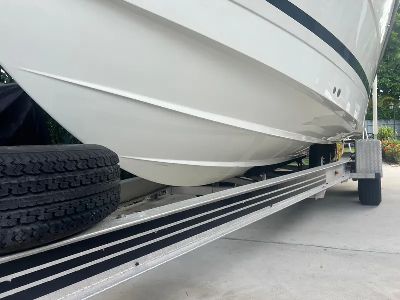 Slide: The Image of 2000 Hydra-Sports 2400 CC Vector boat on trailer, close-up view of hull and tires. - 16