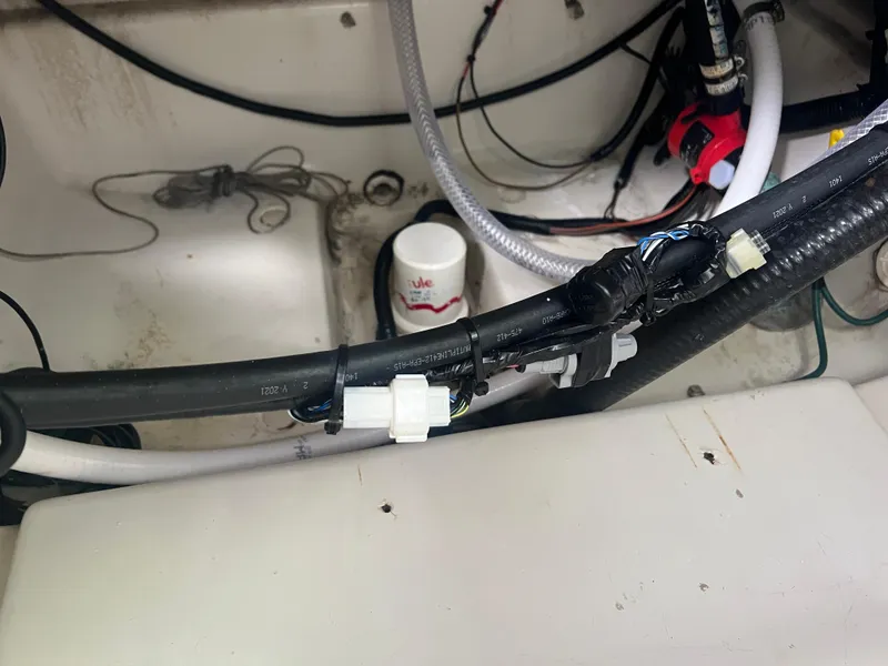 Slide: The Image of Hydra-Sports 2400 CC Vector 2000 boat wiring and plumbing system in the engine compartment. - 20