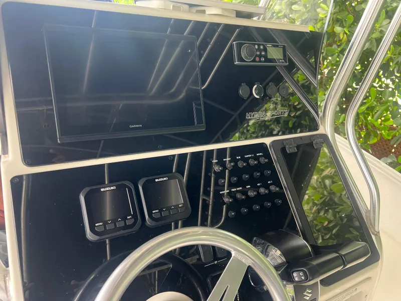 Slide: The Image of Hydra-Sports 2400 CC Vector 2000 boat dashboard with modern controls and navigation equipment. - 22