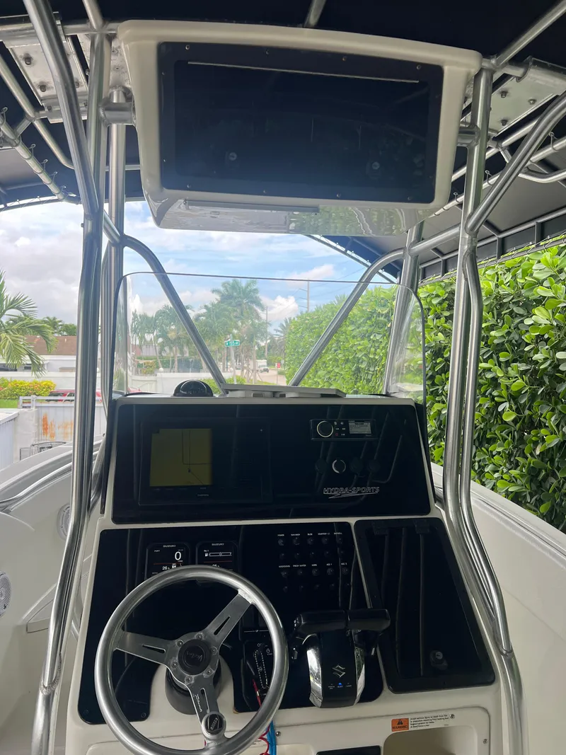 Slide: The Image of 2000 Hydra-Sports 2400 CC Vector boat console with steering wheel and navigation equipment. - 29