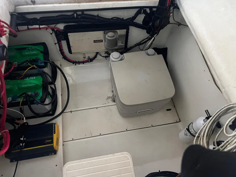 Slide: The Image of 2000 Hydra-Sports 2400 CC Vector boat battery compartment with wiring and equipment. - 37