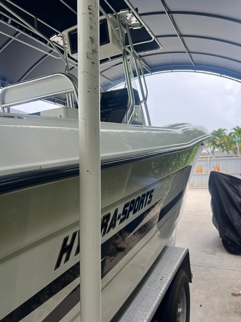Slide: The Image of 2000 Hydra-Sports 2400 CC Vector boat on trailer under canopy. - 4