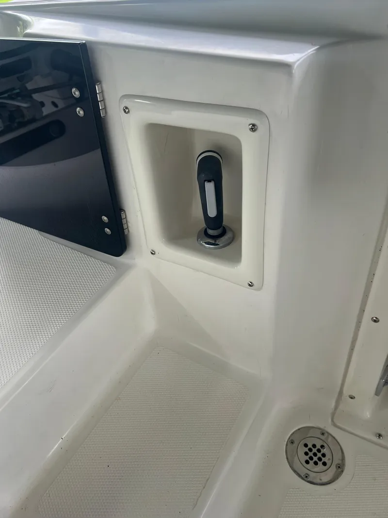 Slide: The Image of Hydra-Sports 2400 CC Vector 2000 boat interior detail with storage compartment. - 40