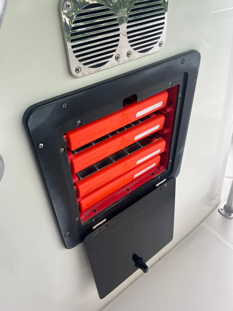 Slide: The Image of Hydra-Sports 2400 CC Vector 2000 boat with red safety equipment storage compartment. - 41