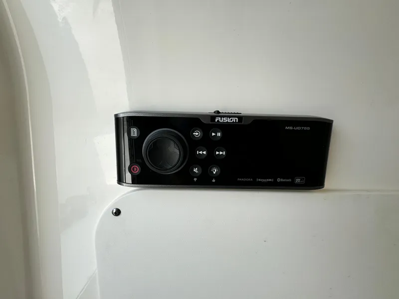 Slide: The Image of Fusion marine stereo system on a 2022 Boston Whaler 330 Outrage boat. - 18