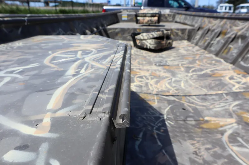 Slide: The Image of 2024 War Eagle 754LDV Sportsman boat interior with camouflage design. - 10