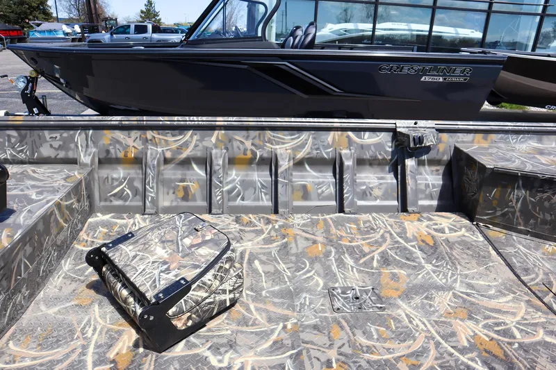 Slide: The Image of 2024 War Eagle 754LDV Sportsman boat with camouflage interior. - 11