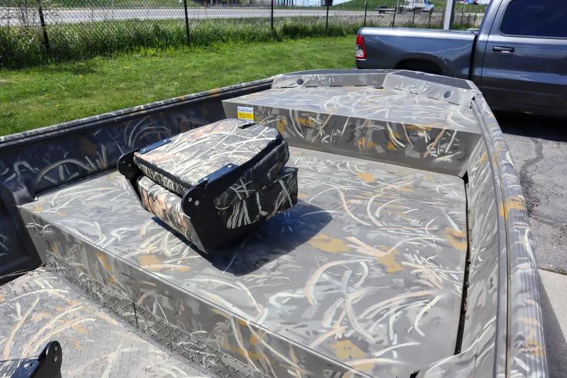 Slide: The Image of 2024 War Eagle 754LDV Sportsman boat with camo interior and Mercury outboard motor. - 12