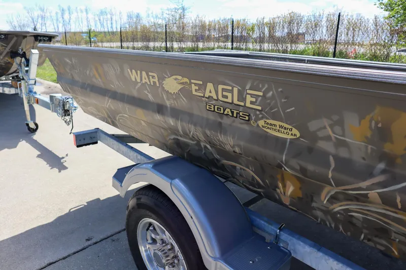 Slide: The Image of 2024 War Eagle 754LDV Sportsman boat on a trailer. - 24